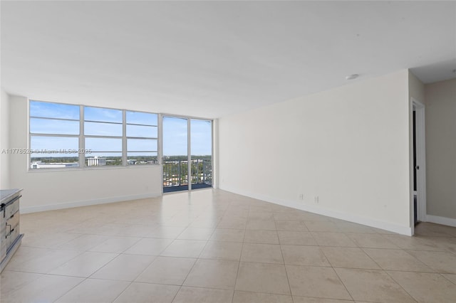 2100 Sans Souci Blvd Unit A1509, North Miami, FL 33181 - unfurnished living room featuring baseboards and light tile patterned floors