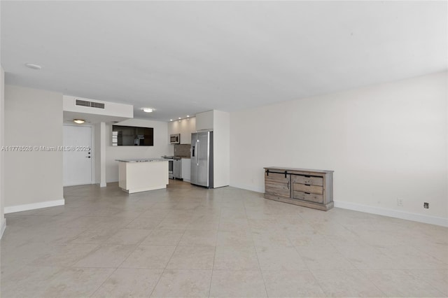 2100 Sans Souci Blvd Unit A1509, North Miami, FL 33181 - unfurnished living room with visible vents, baseboards, and light tile patterned floors
