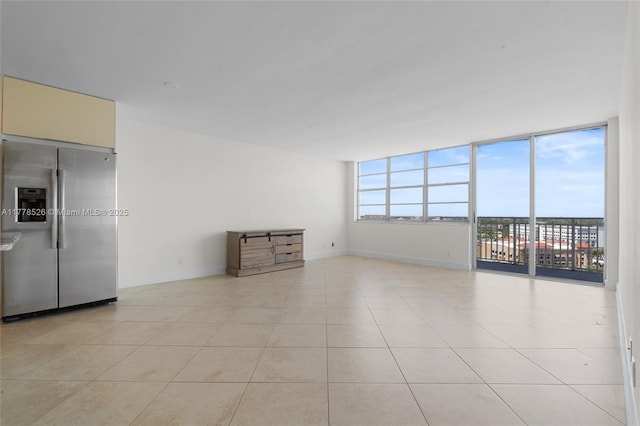 2100 Sans Souci Blvd Unit A1509, North Miami, FL 33181 - empty room featuring baseboards and light tile patterned floors