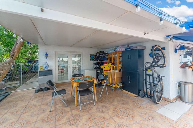 view of patio / terrace with french doors and a gate
