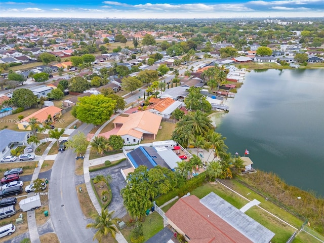 aerial view with a water view and a residential view