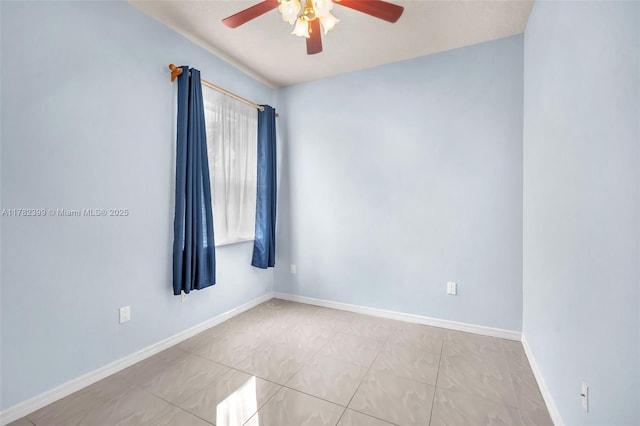 unfurnished room with baseboards, a ceiling fan, and light tile patterned floors