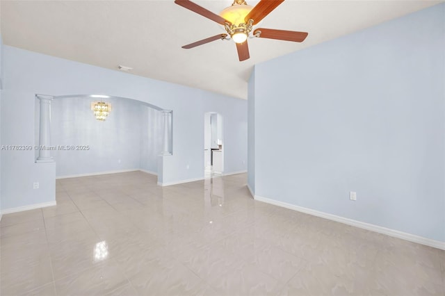 unfurnished room featuring ceiling fan, arched walkways, baseboards, light tile patterned floors, and visible vents