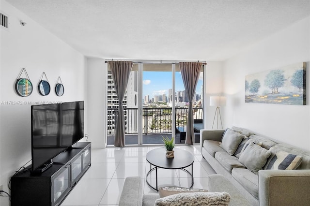 1750 N Bayshore Dr Unit 3106, Miami, FL 33132 - living room with tile patterned flooring, a wall of windows, and a textured ceiling