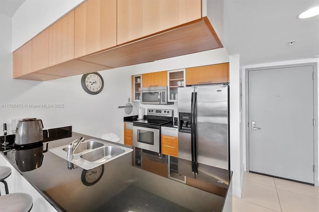 1750 N Bayshore Dr Unit 3106, Miami, FL 33132 - kitchen with stainless steel appliances, glass insert cabinets, dark countertops, a peninsula, and light tile patterned floors