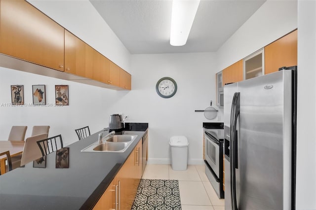 1750 N Bayshore Dr Unit 3106, Miami, FL 33132 - kitchen with appliances with stainless steel finishes, dark countertops, glass insert cabinets, light tile patterned floors, and brown cabinets