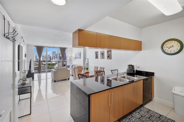 1750 N Bayshore Dr Unit 3106, Miami, FL 33132 - kitchen with dishwashing machine, light tile patterned floors, dark countertops, and a peninsula