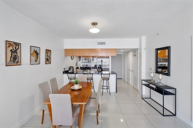 1750 N Bayshore Dr Unit 3106, Miami, FL 33132 - dining space featuring baseboards and light tile patterned flooring