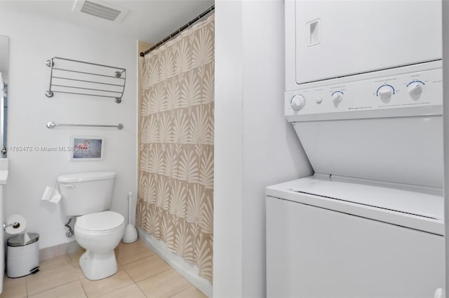 1750 N Bayshore Dr Unit 3106, Miami, FL 33132 - full bathroom featuring stacked washer / drying machine, tile patterned floors, and a shower with curtain