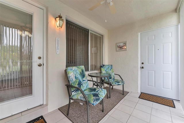 219 Pine Hov Cir Unit C-1, Green Acres, FL 33463 - entrance to property with a ceiling fan and stucco siding