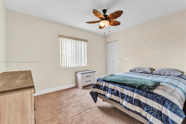219 Pine Hov Cir Unit C-1, Green Acres, FL 33463 - bedroom with light colored carpet, baseboards, ceiling fan, and a closet