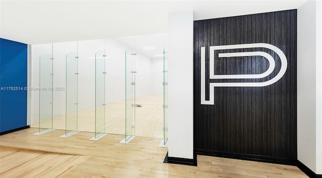 851 NE 1st Ave Ph 5500, Miami, FL 33132 - interior space featuring a stall shower, wood finished floors, and baseboards