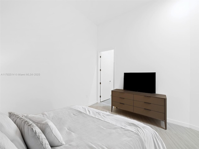 851 NE 1st Ave Ph 5500, Miami, FL 33132 - bedroom with light wood finished floors and baseboards