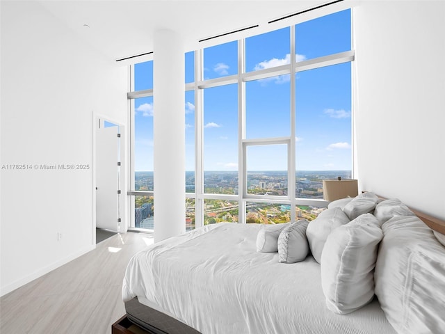 851 NE 1st Ave Ph 5500, Miami, FL 33132 - bedroom with a wall of windows, multiple windows, and a towering ceiling