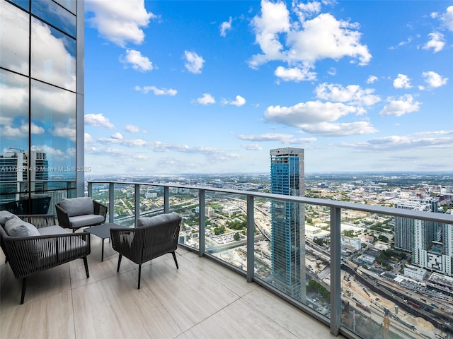 851 NE 1st Ave Ph 5500, Miami, FL 33132 - balcony with an outdoor living space and a city view