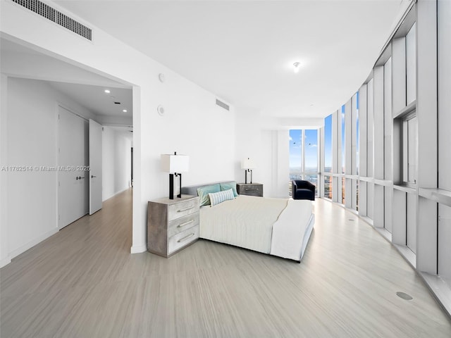 851 NE 1st Ave Ph 5500, Miami, FL 33132 - living room featuring a wall of windows, visible vents, and light wood finished floors