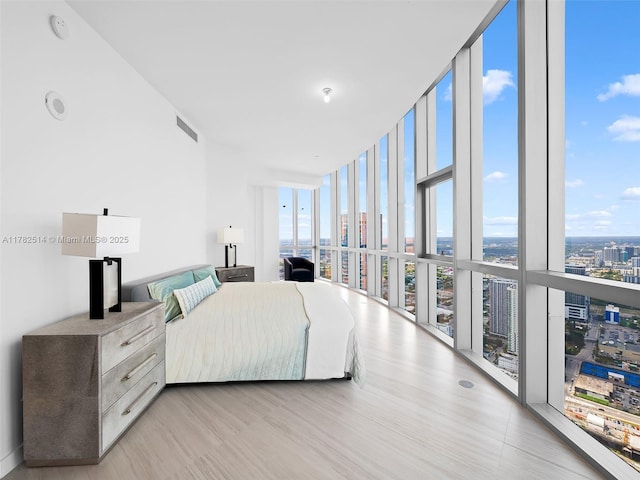 851 NE 1st Ave Ph 5500, Miami, FL 33132 - bedroom featuring multiple windows, a wall of windows, a city view, and visible vents