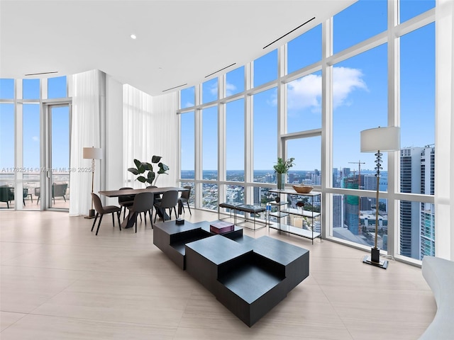 851 NE 1st Ave Ph 5500, Miami, FL 33132 - living area featuring a towering ceiling, floor to ceiling windows, and a city view