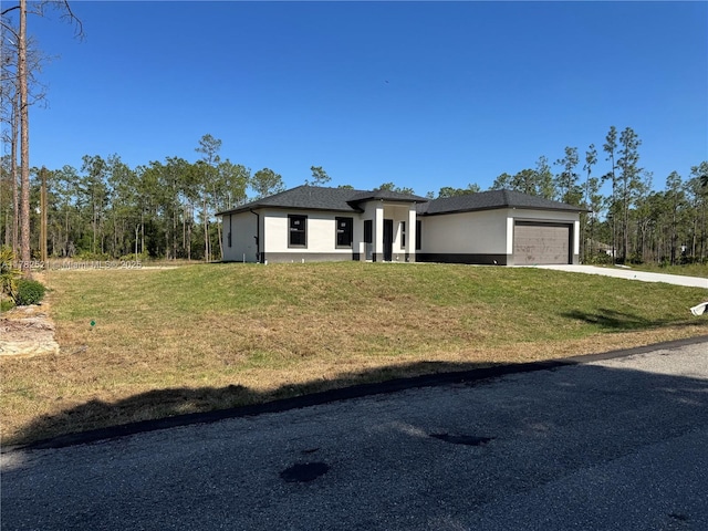 1316 Broadway Ave, Lehigh Acres, FL 33972 - prairie-style home with stucco siding, a garage, concrete driveway, and a front yard