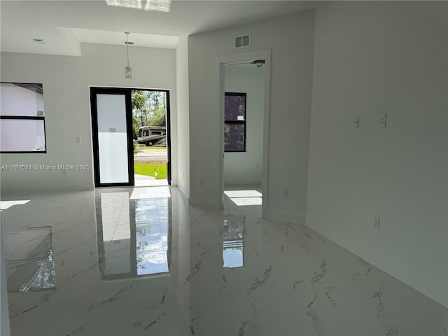 1316 Broadway Ave, Lehigh Acres, FL 33972 - foyer with light marble finish floors and baseboards