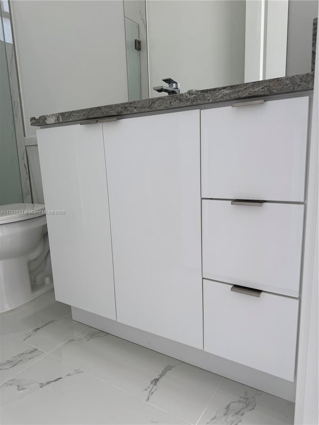 1316 Broadway Ave, Lehigh Acres, FL 33972 - bathroom with marble finish floors, toilet, and a shower