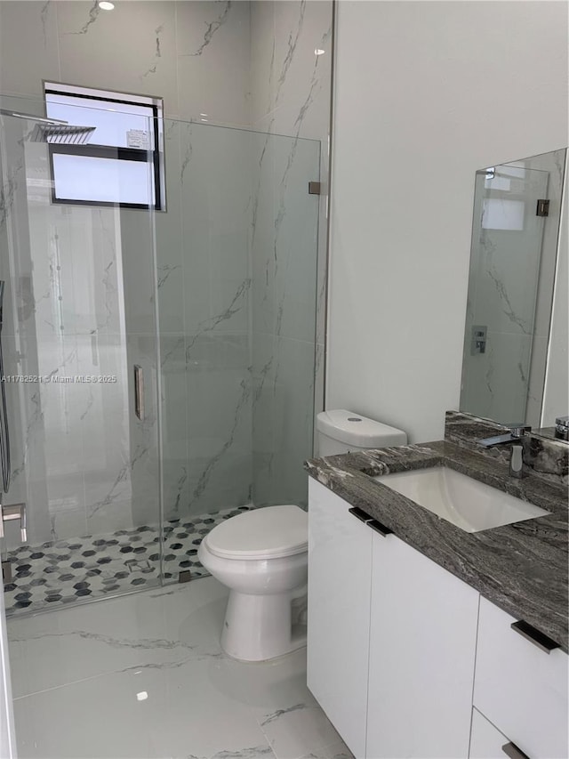 1316 Broadway Ave, Lehigh Acres, FL 33972 - full bath with marble tiled flooring, toilet, a marble finish shower, and vanity