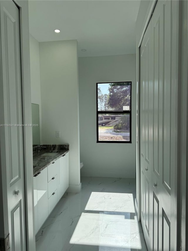 1316 Broadway Ave, Lehigh Acres, FL 33972 - bathroom featuring marble finish flooring, vanity, toilet, and recessed lighting