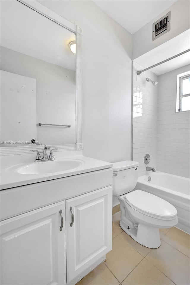 609 NE 13th Ave Unit 301, Fort Lauderdale, FL 33304 - full bathroom with vanity, tile patterned flooring, toilet, visible vents, and bathtub / shower combination