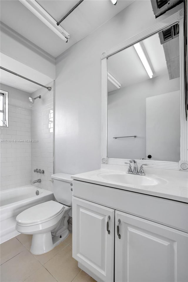609 NE 13th Ave Unit 301, Fort Lauderdale, FL 33304 - full bath featuring vanity, tile patterned flooring, toilet, visible vents, and shower / bathing tub combination
