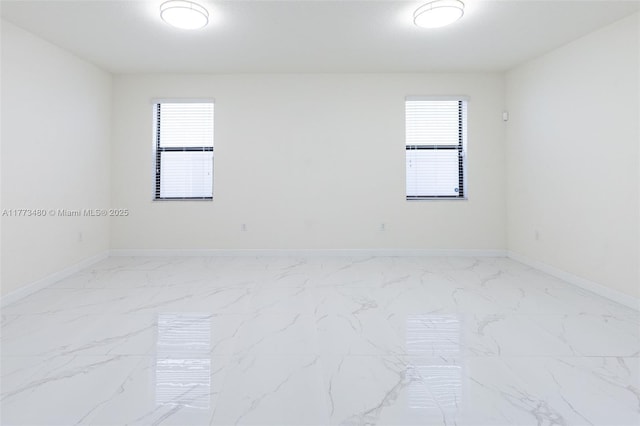 10572 W 35th Way, Hialeah, FL 33018 - spare room featuring baseboards and marble finish floors