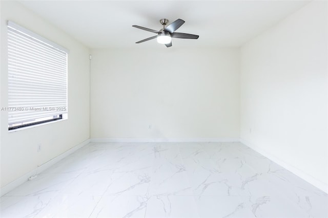 10572 W 35th Way, Hialeah, FL 33018 - empty room featuring healthy amount of natural light, a ceiling fan, and light marble finish flooring