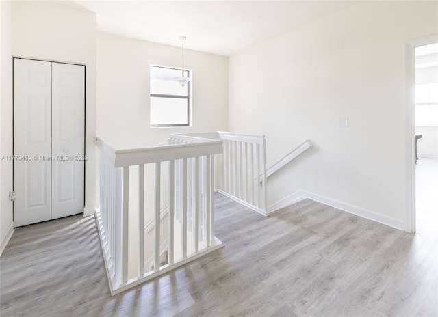 10572 W 35th Way, Hialeah, FL 33018 - hallway featuring an upstairs landing and wood finished floors