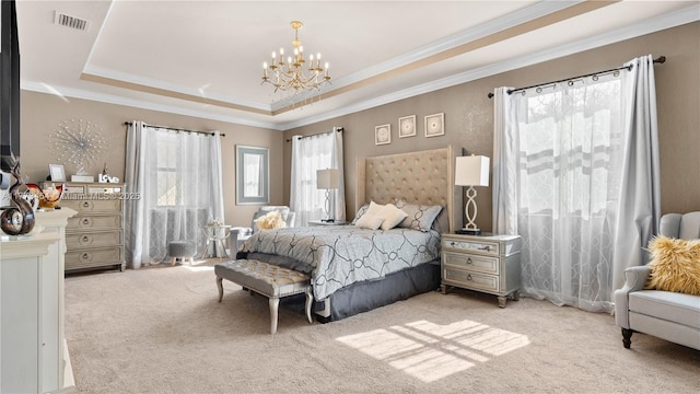 bedroom featuring a chandelier, a tray ceiling, light colored carpet, and crown molding