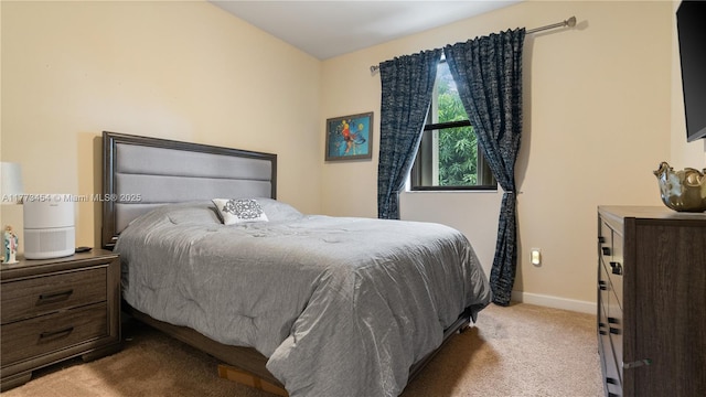 bedroom with baseboards and carpet floors