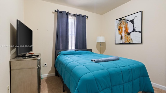 carpeted bedroom with baseboards