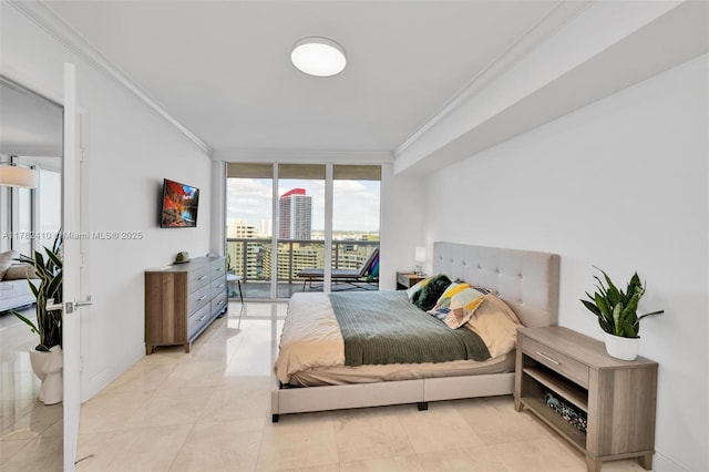 1850 S Ocean Dr Unit 1709, Hallandale Beach, FL 33009 - bedroom featuring ornamental molding, baseboards, access to outside, and expansive windows