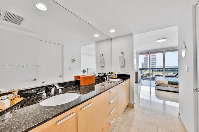 1850 S Ocean Dr Unit 1709, Hallandale Beach, FL 33009 - ensuite bathroom with tile patterned floors, double vanity, a sink, and visible vents