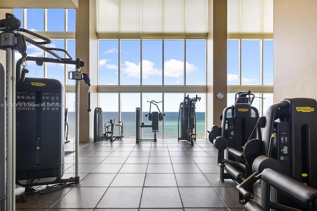 1850 S Ocean Dr Unit 1709, Hallandale Beach, FL 33009 - exercise room featuring a wealth of natural light, expansive windows, a towering ceiling, and a water view