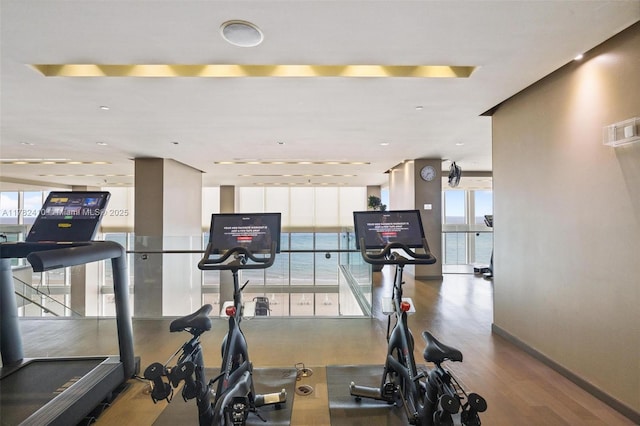 1850 S Ocean Dr Unit 1709, Hallandale Beach, FL 33009 - workout area with visible vents, baseboards, wood finished floors, and a healthy amount of sunlight