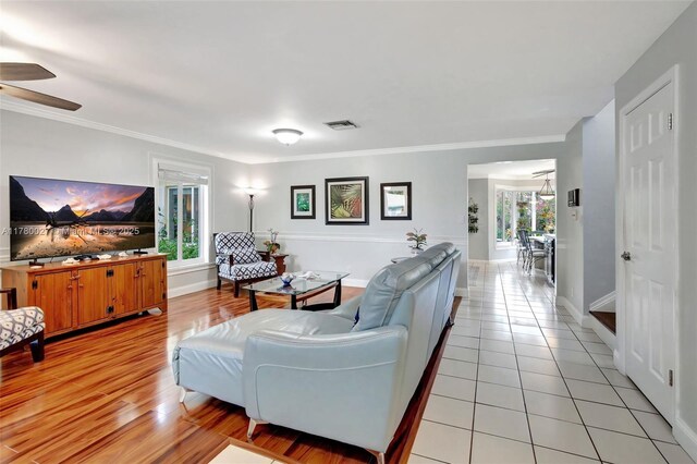 1780 SW 51st Ter, Plantation, FL 33317 - living area featuring plenty of natural light, ceiling fan, crown molding, baseboards, and light tile patterned flooring