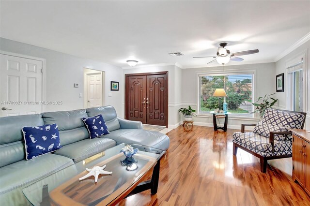 1780 SW 51st Ter, Plantation, FL 33317 - living room with light wood-style flooring, ceiling fan, crown molding, and baseboards