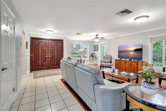 1780 SW 51st Ter, Plantation, FL 33317 - living room featuring ceiling fan, healthy amount of natural light, light tile patterned floors, and ornamental molding