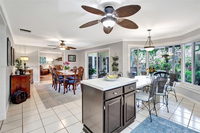 1780 SW 51st Ter, Plantation, FL 33317 - kitchen with ceiling fan, light tile patterned floors, light countertops, and a center island