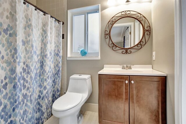1780 SW 51st Ter, Plantation, FL 33317 - full bath featuring vanity, toilet, tile patterned flooring, and a shower with curtain