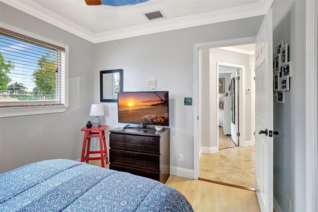 1780 SW 51st Ter, Plantation, FL 33317 - bedroom featuring crown molding, wood finished floors, and baseboards