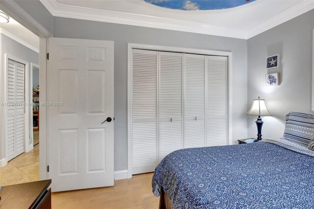 1780 SW 51st Ter, Plantation, FL 33317 - bedroom with a closet, crown molding, light wood-style flooring, and baseboards
