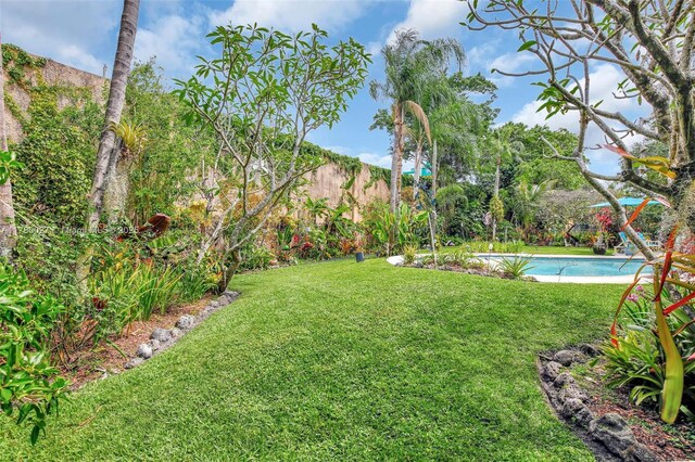 1780 SW 51st Ter, Plantation, FL 33317 - view of green lawn with an outdoor pool