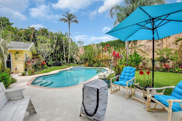 1780 SW 51st Ter, Plantation, FL 33317 - outdoor pool with a patio area and a lawn