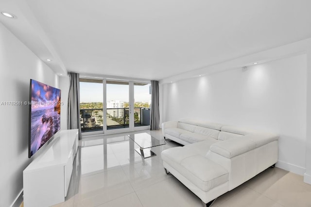 3140 S Ocean Dr Unit 1011, Hallandale Beach, FL 33009 - living room featuring light tile patterned flooring, baseboards, and recessed lighting