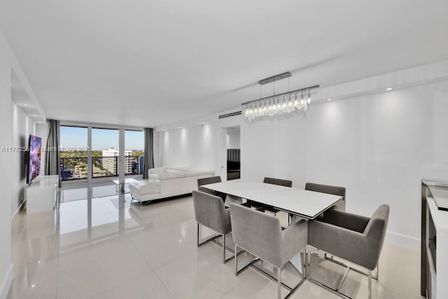 3140 S Ocean Dr Unit 1011, Hallandale Beach, FL 33009 - dining room featuring light tile patterned floors, baseboards, and expansive windows